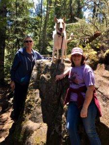 Wade, Tag, and Veleda happily posed in the woods.