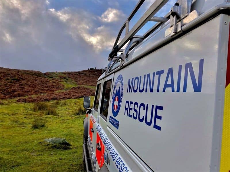 the side of an emergency vehicle heading into the foothils reads "Calder Valley Mountain Rescue