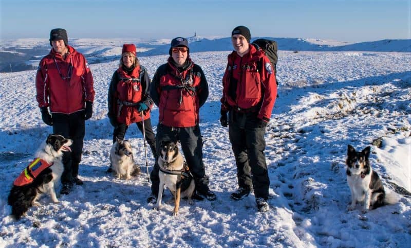 4 dog handlers with their dogs, including Stephen and Finn