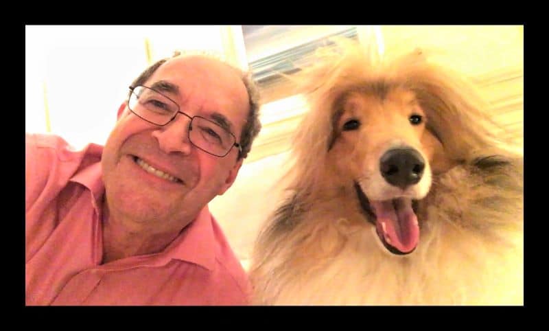 Jeff and Cody take a selfie, headshots of themselves close together while smiling at the camera