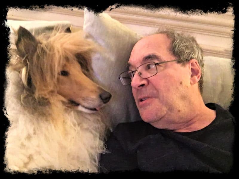 Cody and Jeff lie beside each other propped up on pillows and looking deep in conversation