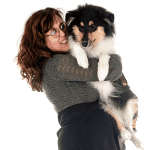 woman holding rough collie puppy